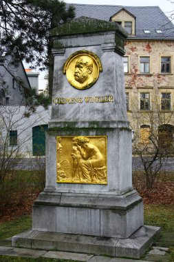 Freiberg, Germany - March 16, 2024: Monument to Clemens Winkler, a German chemist who discovered the element germanium in 1886 in Freiberg. clipart
