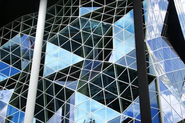 stock image Berlin, Germany - July 8, 2024: Glass facade of headquarters of Axel Springer SE, a German multinational mass and online media company, based in Berlin