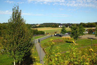 Oelsnitz, Germany - July 30, 2024: Grounds of the 2015 State Garden Show in Oelsnitz, a historic mining town in the Ore Mountains, Saxon clipart