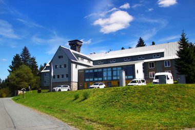 Klingenthal, Germany - August 11, 2024: Youth hostel and observation tower, named after Otto Hermann Boehm. Located in Klingenthal, Vogtland district of Saxony, on the local Aschberg mountain. clipart