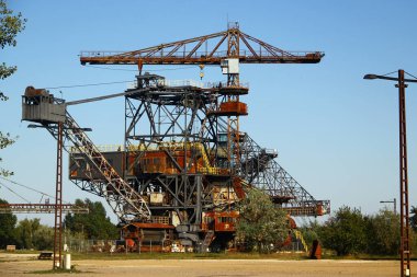 Graefenheinichen, Germany - September 21, 2024: Ferropolis (City of Iron), an open-air museum of huge industrial machines and a venue for music festivals on the site of a former strip mining operation clipart