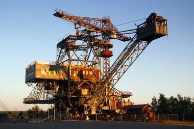 Graefenheinichen, Germany - September 21, 2024: Ferropolis (City of Iron), an open-air museum of huge industrial machines and a venue for music festivals on the site of a former strip mining operation clipart