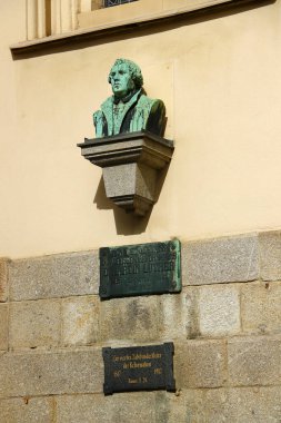 Markneukirchen, Germany - September 28, 2024: Bust of Martin Luther on St. Nicholas church in Markneukirchen, a town in the Vogtlandkreis district of Saxony. clipart