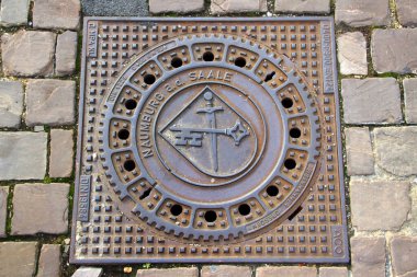 Naumburg, Germany - October 16, 2024: Manhole cover with coat of arms of Naumburg, a town in Saxony-Anhalt clipart