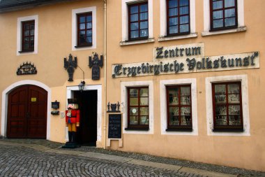 Schneeberg, Germany - March 26, 2024: Erzgebirge Folk Art Center in central Schneeberg, a historical mining town in the Ore Mountains, Saxony, Germany clipart