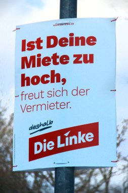 Bad Brambach, Germany - February 16, 2024: Election poster from left-wing Die Linke party, saying If your rent is too high, the landlord is happy. That's why vote for The Left. clipart