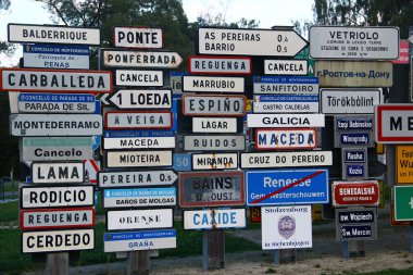 Oberkotzau, Germany - September 28, 2025: Fernweh (Wanderlust) park, a collection of signs from places all over the world. The project by filmmaker Klaus Beer against xenophobia and racism.