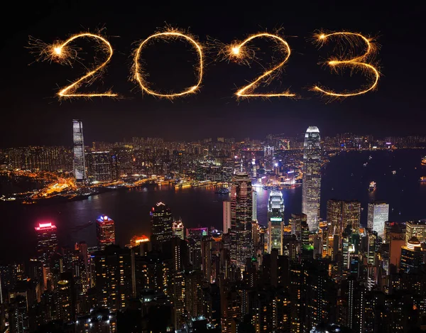 2023 Happy New Year fireworks celebrating over Hong Kong cityscape at night
