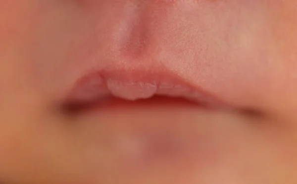 close up mouth of newborn baby
