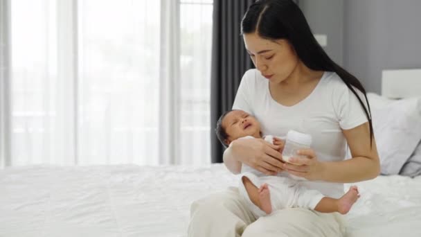 Mother Holding Consoling Her Crying Newborn Baby Arms Bed — Stockvideo
