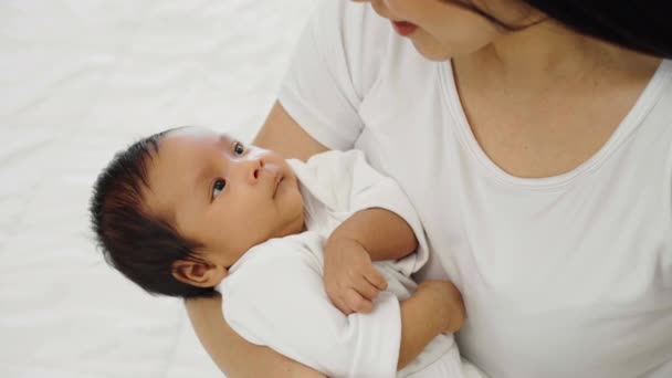 Mother Holding Talking Her Newborn Baby Bed — Vídeo de Stock