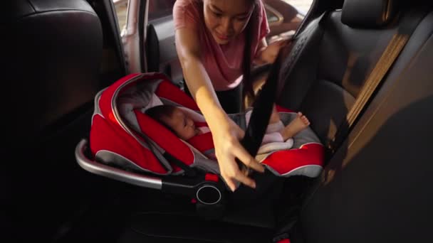 Mother Fastening Safety Belt Newborn Baby Car Seat — Stock Video