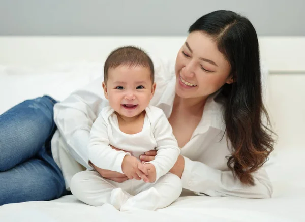 Happy Mother Her Infant Baby Sitting Playing Bed — Stock Photo, Image