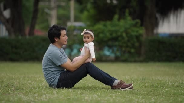 Happy Father Sitting Kissing His Infand Baby Green Grass Filed — Video Stock