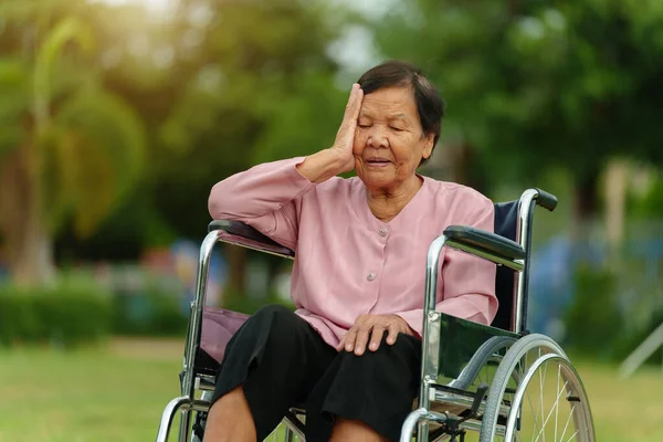 Stressed Senior Woman Suffering Headache While Sitting Wheelchair Park — Photo