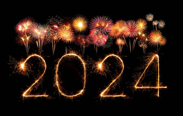 2024 happy new year fireworks celebration written sparkling at the night