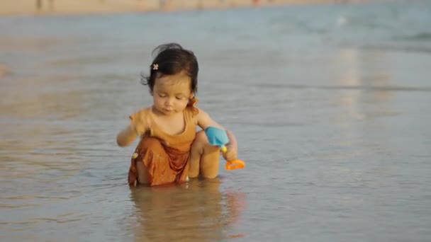 Happy Toddler Baby Girl Playing Toy Water Sea Beach Royalty Free Stock Footage