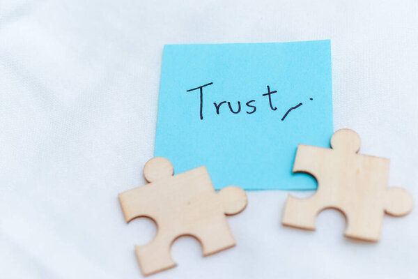 Building business trust puzzle pieces of partnership office space visual concept minimalist setting close-up view for effective collaboration