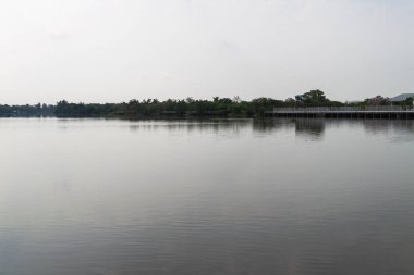 A tranquil lake reflects the serene landscape inviting calmness and peace for all who visit.