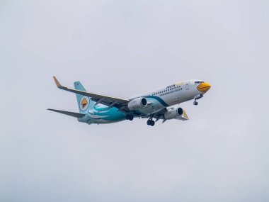 Bangkok, Tayland-26 Aralık 2024: Bangkok 'taki Donmueang Havaalanı' na iniş için bir uçak yaklaşıyor..