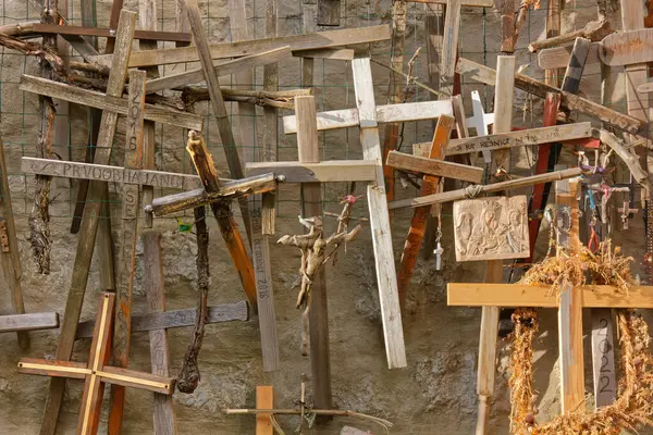 stock image SOLKAN, Slovenia - July 21, 2024 - Peculiar display of wooden crosses and sculptures at the Sveta Gora shrine