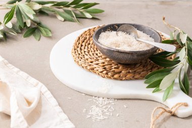 Organic raw long grain rice - Basic cereal for food. Healthy food ingredients on kitchen countertop