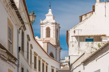 Detail of architecture of the streets of the city center with typical construction on a summer day. View of street in the old town Faro.