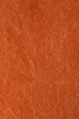 Lüks klasik arka plan olarak kullanılan turuncu deri dokular. Taklit, yapay deri dokusu arka planı. Soyut