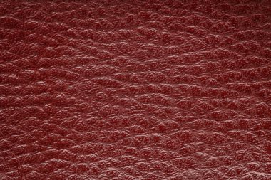 Lüks klasik arka plan olarak kullanılan koyu kırmızı deri. Taklit deri doku arka planı. Soyut