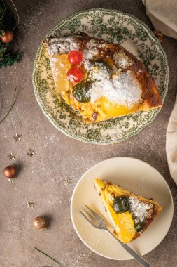 Bolo Rei or Kings Cake is a traditional Xmas cake with fruits raisins nut and icing on kitcthen countertop. Is made for Christmas, Carnavale or Mardi Gras