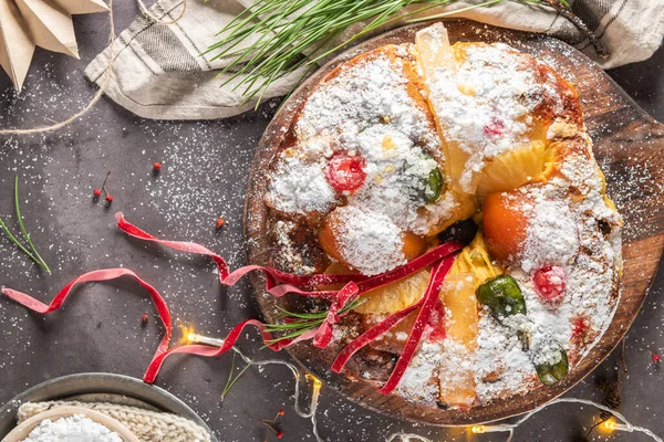 Bolo Rei or Kings Cake is a traditional Xmas cake with fruits raisins nut and icing on kitcthen countertop. Is made for Christmas, Carnavale or Mardi Gras