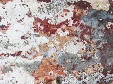 Eski yıpranmış duvar arkaplan dokusu. Kırmızı, kirli, alçıdan duvardan dökülen boya taneleri..