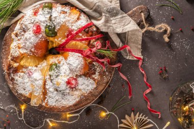 Bolo Rei or Kings Cake is a traditional Xmas cake with fruits raisins nut and icing on kitcthen countertop. Is made for Christmas, Carnavale or Mardi Gras