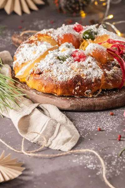 Bolo Rei or Kings Cake is a traditional Xmas cake with fruits raisins nut and icing on kitcthen countertop. Is made for Christmas, Carnavale or Mardi Gras