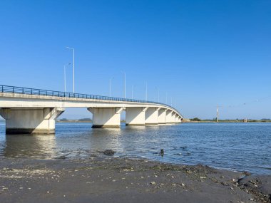 Varela Bridge over the Ria de Aveiro establishes the connection between Murtosa and Torreira, Aveiro, Portugal clipart