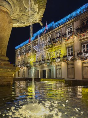 Santa Maria da Feira, Portugal - november 30 2024. A walker s point of view of the old city streets decorated with Christmas lights. The decoration remains the same throughout the Perlim theme park. clipart