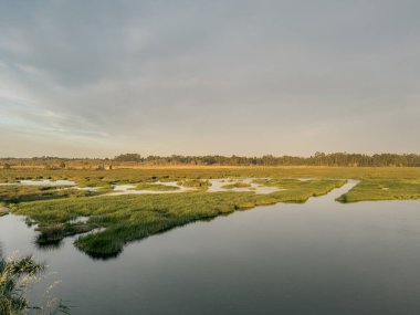 View of sunset on Ria de Aveiro, Ovar, Portugal clipart