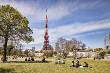 5 April 2019: Tokyo, Japan - Lunchtime in spring, in Shiba Park, Central Tokyo, near the Tokyo Tower. clipart