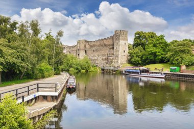 4 July 2020: Newark on Trent, Nottinghamshure, UK - Newark Caste, beside the River Trent, with boats moored at the quay.