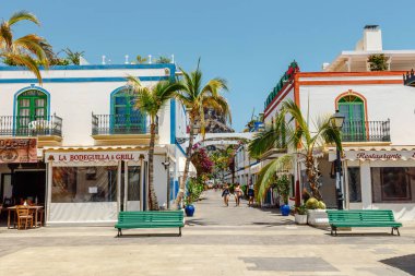 Puerto de Mogan, Gran Canaria, Spain. 18 July 2022: Narrow and flowery streets of Puerto de Mogan are eagerly visited by tourists