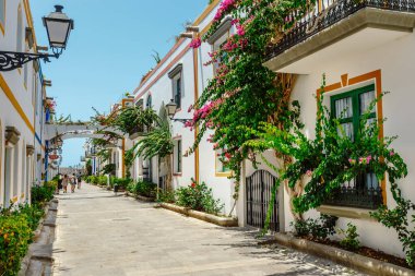 Puerto de Mogan, Gran Canaria, Spain. 18 July 2022: Narrow and flowery streets of Puerto de Mogan are eagerly visited by tourists