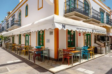 Puerto de Mogan, Gran Canaria, Spain. 18 July 2022: Narrow and flowery streets of Puerto de Mogan are eagerly visited by tourists