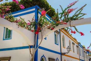 historic center of puerto de mogan with lots of bougainvillea flowers, Canary Island
