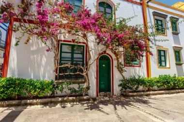 historic center of puerto de mogan with lots of bougainvillea flowers, Canary Island