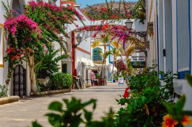 Puerto de Mogan, Gran Canaria, Spain, 18 July, 2022: Bougainvillea flowers growing in the streets of Puerto de Mogan. Gran Canaria, Spain