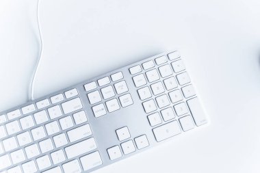 The modern and stylish keyboard for a computer Keyboard White wireless computer keyboard isolated on white background. English keyboard layout