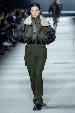 MILAN, ITALY - FEBRUARY 24: A model walks the runway at the Tods fashion show during the Milan Fashion Week Womenswear Fall/Winter 2023/2024 on February 24, 2023 in Milan, Italy. clipart