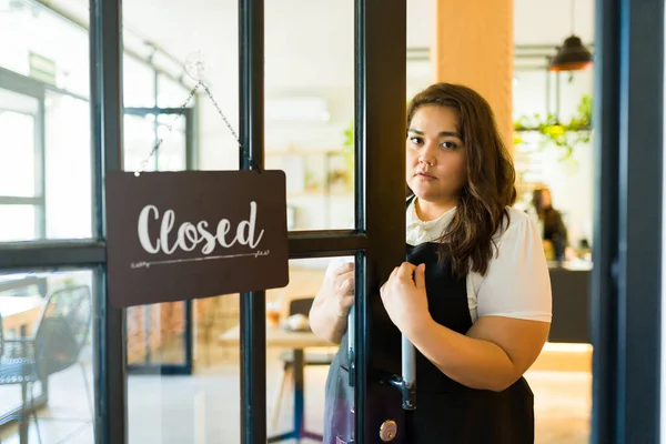 stock image Stressed entrepreneur looking sad and worried while opening her new business restaurant