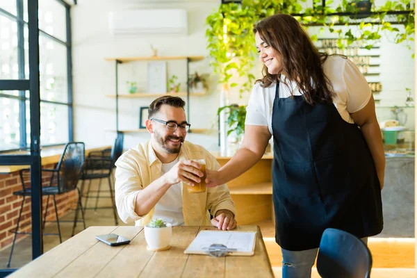 Hispanic Waitress Bringing Coffee Happy Man Customer Sitting Table Cafe — Stock Photo, Image