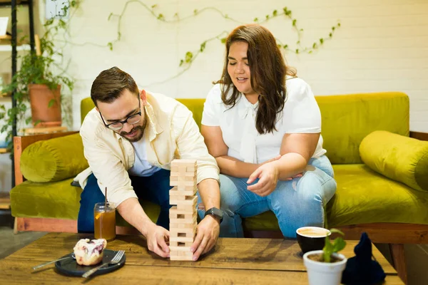 Happy Boyfriend Girlfriend Having Fun Playing Blocks Board Game Coffee — Stock Photo, Image